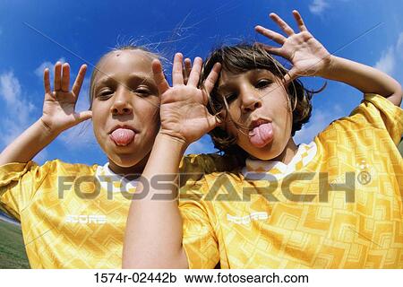 Portrait of two girls making faces View Large Photo Image Stock Image - Portrait of two girls making faces. Fotosearch