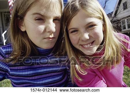 Portrait of two teenage girls smiling View Large Photo Image Picture - Portrait of two teenage girls smiling. Fotosearch