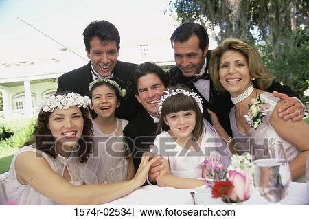 Stock Image - Portrait of wedding guests with a newlywed couple. Fotosearch
