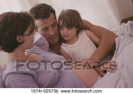 Pregnant woman with her husband and her daughter View Large Photo Image Stock Image - Pregnant woman with her husband and her daughter. Fotosearch