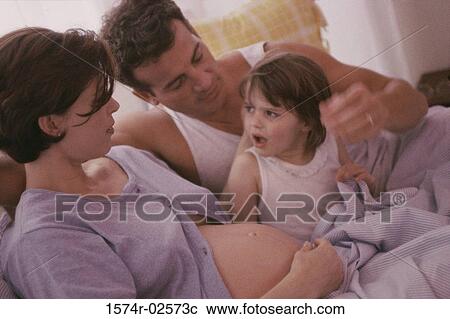 Pregnant woman with her husband and her daughter View Large Photo Image Stock Image - Pregnant woman with her husband and her daughter. Fotosearch