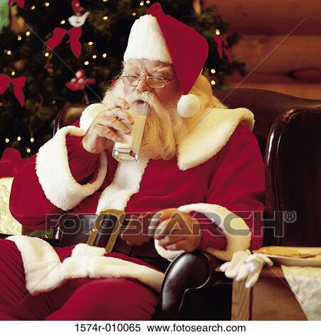 Santa Claus drinking a glass of milk View Large Photo Image Stock Photography - Santa Claus drinking a glass of milk. Fotosearch