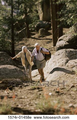 Stock Image - Senior couple hiking. Fotosearch