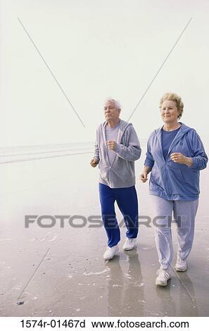 Senior couple jogging at the beach View Large Photo Image Stock Image - Senior couple jogging at the beach. Fotosearch