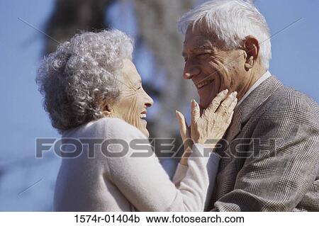 Stock Image - Senior couple looking at each other. Fotosearch
