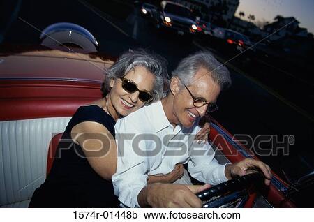 Senior couple sitting in a convertible car View Large Photo Image Stock Image - Senior couple sitting in a convertible car. Fotosearch
