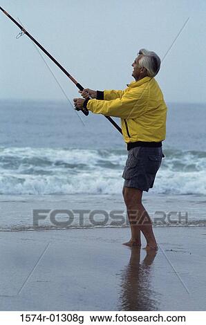 Senior man fishing at the beach View Large Photo Image Stock Image - Senior man fishing at the beach. Fotosearch