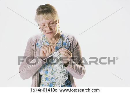 Senior woman knitting View Large Photo Image Stock Image - Senior woman knitting. Fotosearch