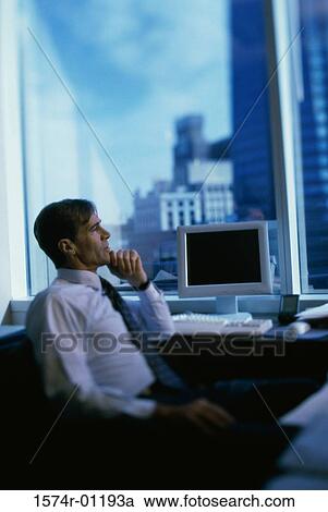 Side profile of a businessman sitting with his hand on his chin View Large Photo Image Stock Image - Side profile of a businessman sitting with his hand on his chin. Fotosearch