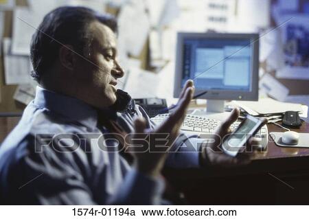 Side profile of a businessman talking on a telephone View Large Photo Image Stock Image - Side profile of a businessman talking on a telephone. Fotosearch