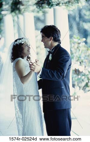 Side profile of a newlywed couple dancing View Large Photo Image Stock Image - Side profile of a newlywed couple dancing. Fotosearch