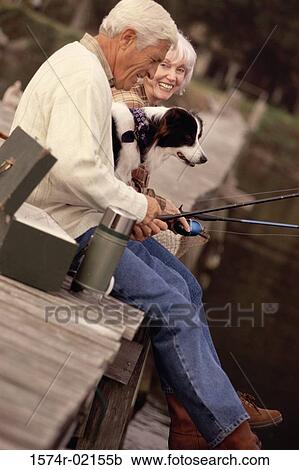 Side profile of a senior couple fishing on a pier with their dog View Large Photo Image Stock Image - Side profile of a senior couple fishing on a pier with their dog. Fotosearch
