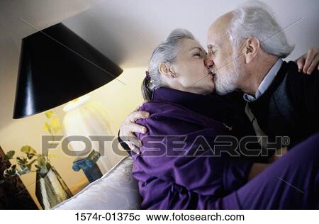 Side profile of a senior couple kissing View Large Photo Image Stock Image - Side profile of a senior couple kissing. Fotosearch