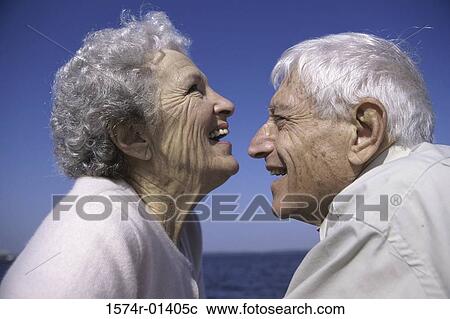 Side profile of a senior couple laughing View Large Photo Image Stock Image - Side profile of a senior couple laughing. Fotosearch