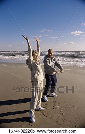 Side profile of a senior couple exercising on the beach View Large Photo Image Stock Image - Side profile of a senior couple exercising on the beach. Fotosearch