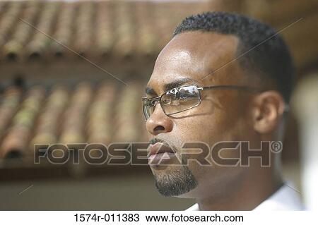 Side profile of a young man View Large Photo Image Stock Image - Side profile of a young man. Fotosearch