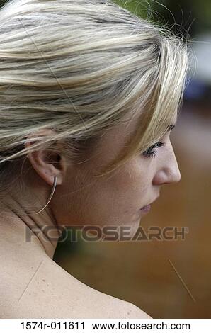 Stock Image - Side profile of a young woman. Fotosearch