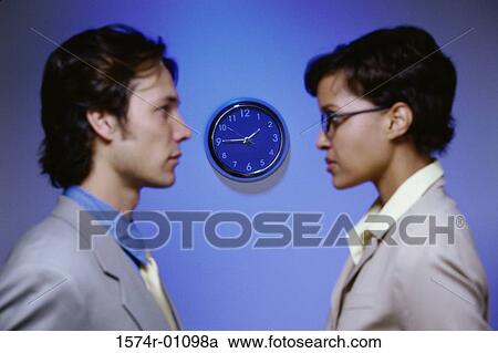 Side profile of businessman and a businesswoman looking at each other View Large Photo Image Stock Image - Side profile of businessman and a businesswoman looking at each other. Fotosearch