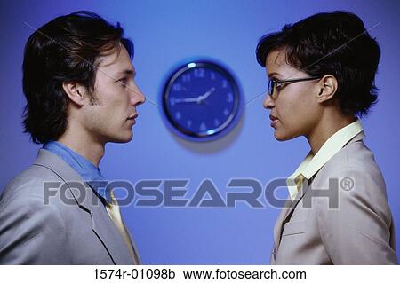 Side profile of businessman and a businesswoman looking at each other View Large Photo Image Stock Image - Side profile of businessman and a businesswoman looking at each other. Fotosearch