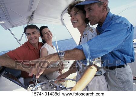 Side profile of two mature couples on a boat View Large Photo Image Stock Image - Side profile of two mature couples on a boat. Fotosearch