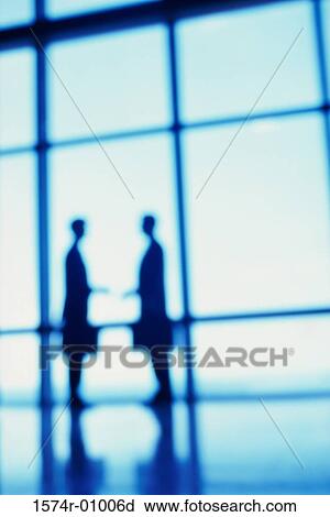 Silhouette of two business executives View Large Photo Image Stock Image - Silhouette of two business executives. Fotosearch