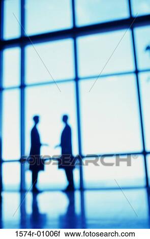 Silhouette of two business executives View Large Photo Image Stock Image - Silhouette of two business executives. Fotosearch