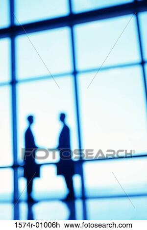 Stock Image - Silhouette of two business executives. Fotosearch