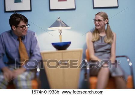 Teenage girl and a young man looking at each other View Large Photo Image Stock Image - Teenage girl and a young man looking at each other. Fotosearch
