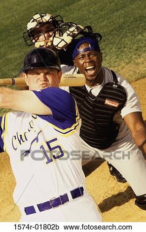 Stock Image - Three mid adult men playing baseball. Fotosearch