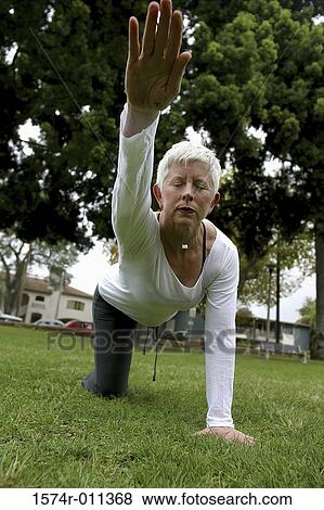 Stock Photo - tree, grass, leisure, eyes closed, casual, well, human. Fotosearch