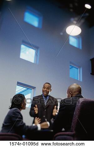Two businessmen and a businesswoman in a meeting View Large Photo Image Stock Image - Two businessmen and a businesswoman in a meeting. Fotosearch