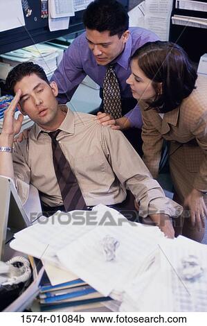 Stock Image - Two businessmen and a businesswoman having a discussion. Fotosearch
