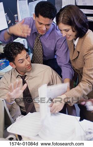 Two businessmen and a businesswoman having a discussion View Large Photo Image Stock Image - Two businessmen and a businesswoman having a discussion. Fotosearch