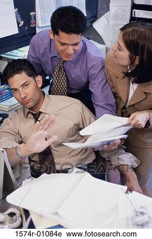 Two businessmen and a businesswoman having a discussion View Large Photo Image Stock Image - Two businessmen and a businesswoman having a discussion. Fotosearch