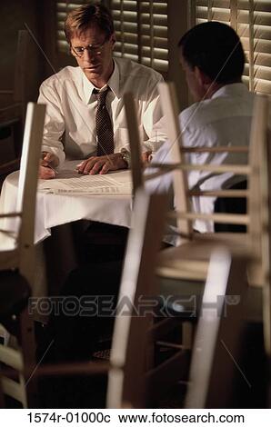 Two businessmen sitting together View Large Photo Image Stock Image - Two businessmen sitting together. Fotosearch