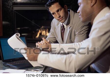 Two businessmen talking View Large Photo Image Stock Image - Two businessmen talking. Fotosearch