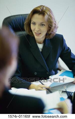 Two businesswomen in a meeting View Large Photo Image Stock Image - Two businesswomen in a meeting. Fotosearch