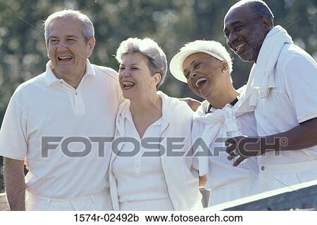 Two senior couples standing together View Large Photo Image Stock Image - Two senior couples standing together. Fotosearch