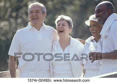Two senior couples standing together View Large Photo Image Stock Image - Two senior couples standing together. Fotosearch