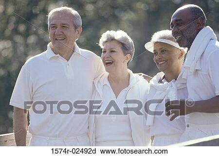 Two senior couples standing together View Large Photo Image Stock Image - Two senior couples standing together. Fotosearch