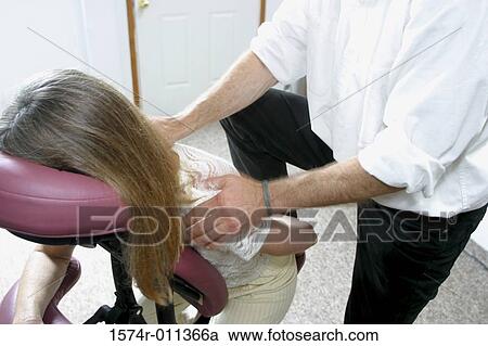 Woman getting a back massage View Large Photo Image Stock Image - Woman getting a back massage. Fotosearch