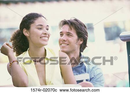 Young couple smiling View Large Photo Image Stock Image - Young couple smiling. Fotosearch