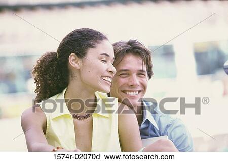 Young couple smiling View Large Photo Image Stock Image - Young couple smiling. Fotosearch