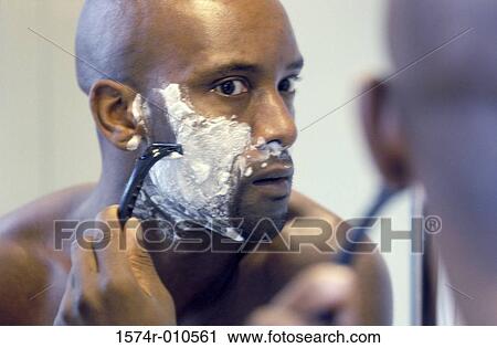 Young man shaving View Large Photo Image Stock Image - Young man shaving. Fotosearch