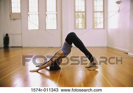 Young woman exercising on the floor View Large Photo Image Stock Image - Young woman exercising on the floor. Fotosearch