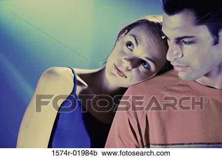 Young woman resting her head on a young man's shoulder View Large Photo Image Stock Image - Young woman resting her head on a young man's shoulder. Fotosearch