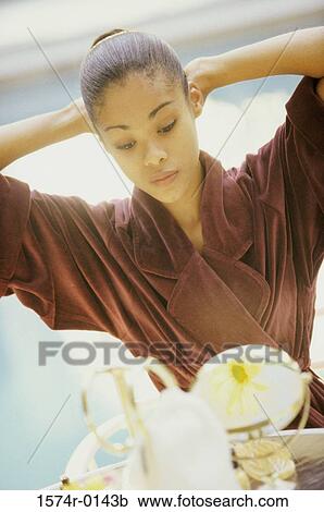 Young woman wearing a bathrobe View Large Photo Image Stock Image - Young woman wearing a bathrobe. Fotosearch
