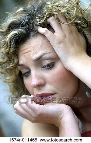 Young woman with her hand on her head View Large Photo Image Stock Photography - Young woman with her hand on her head. Fotosearch