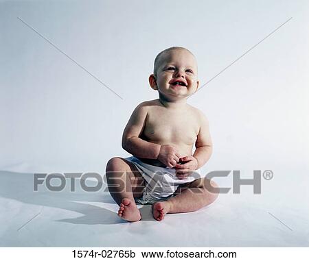 Baby boy sitting and smiling View Large Photo Image Stock Image - Baby boy sitting and smiling. Fotosearch