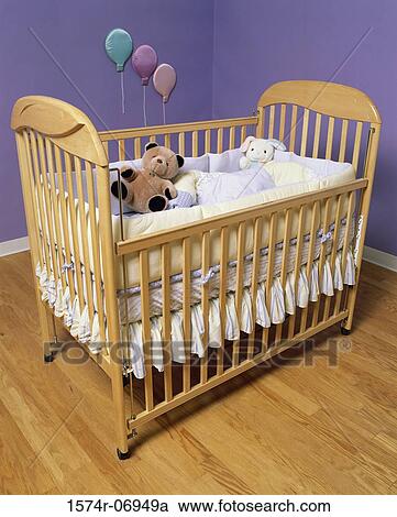 Stock Image - Baby's crib and toys. Fotosearch